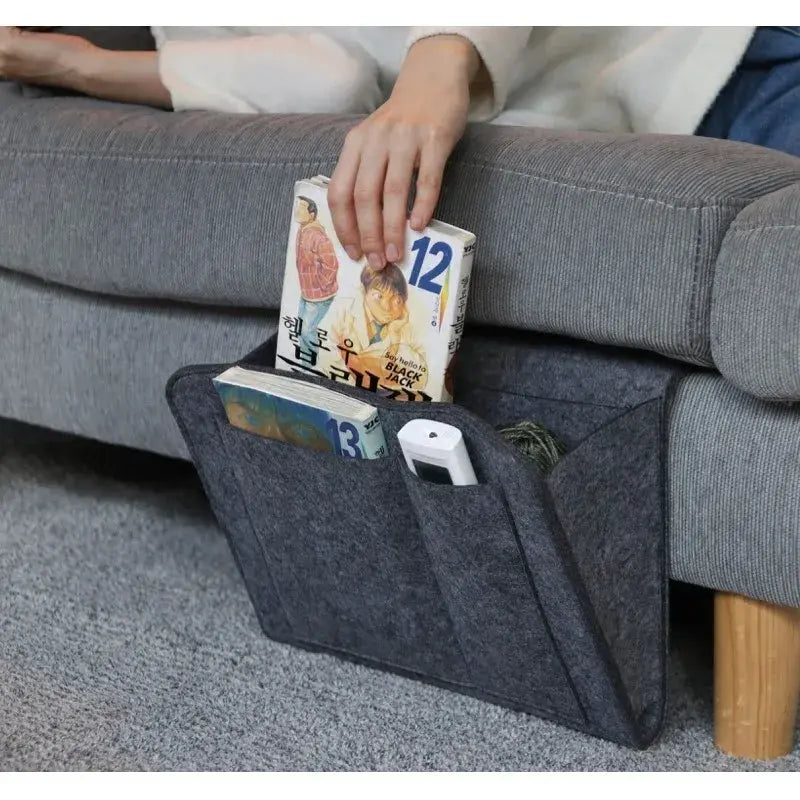 AmoorCity Felt Bedside Caddy. Felt bedside organizer with 5 pockets for storing phones, books, glasses, and other bedside essentials. Keeps items within reach while you relax in bed.